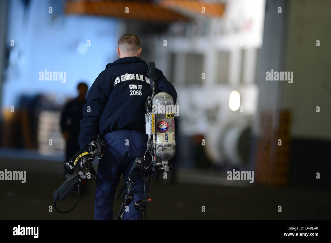 Navy Inhaler A Sailor aboard a Navy vessel in the Atlantic Ocean carries a self ...