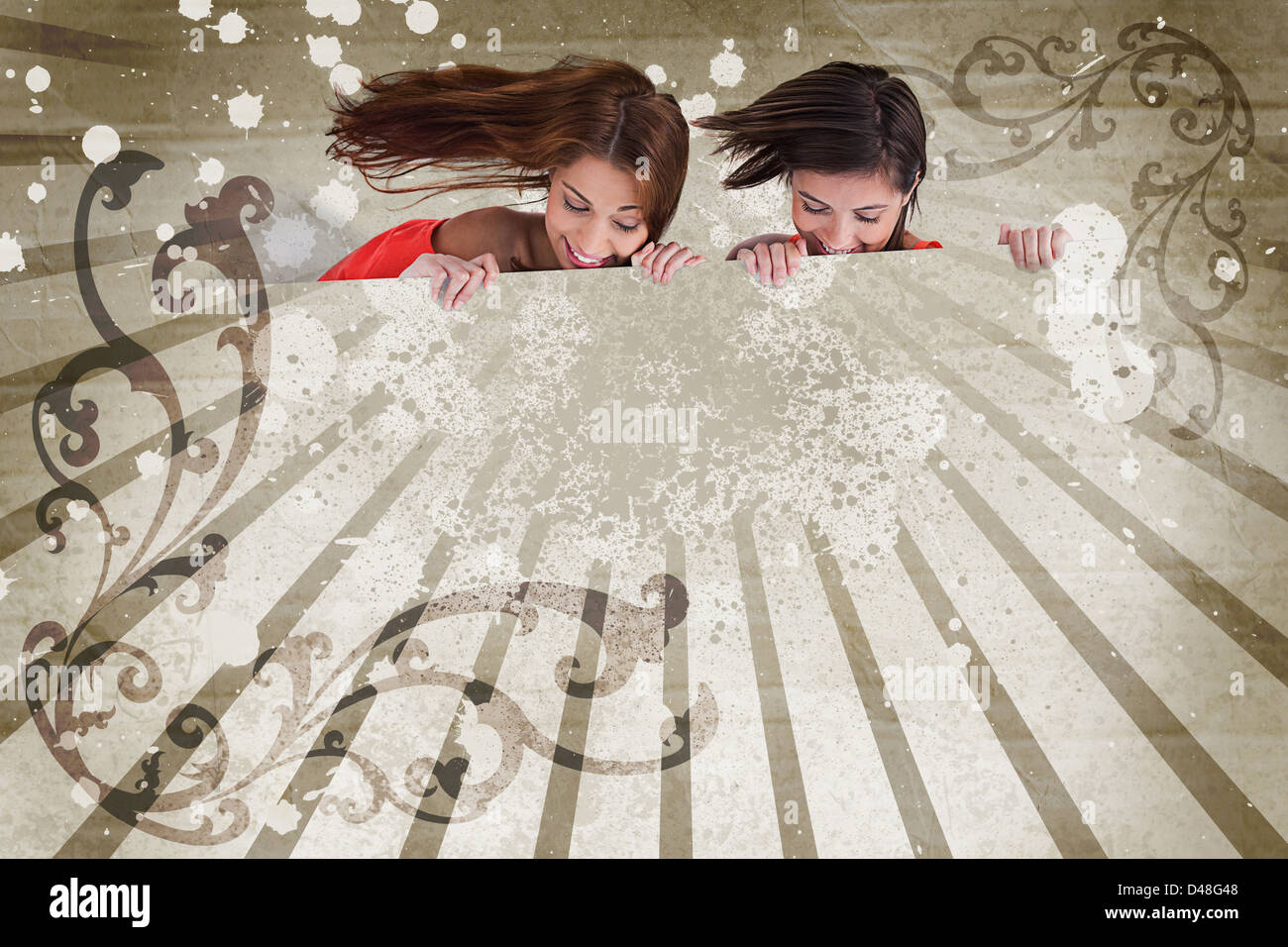 Girls looking down on copy space on art deco style background Stock Photo
