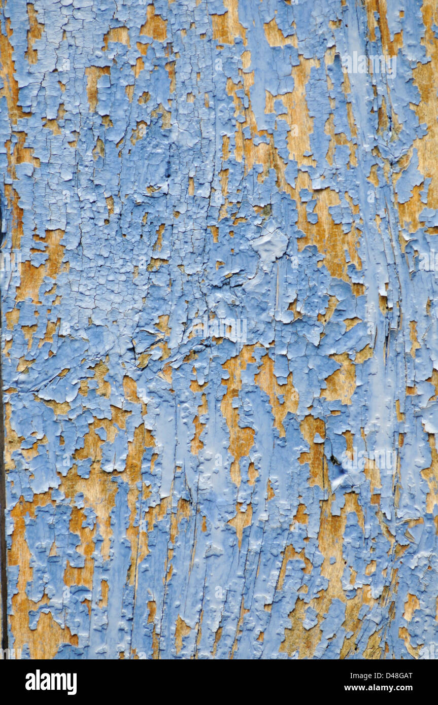 Blue paint flaking off a window shutter and iron fixings. Beautiful texture. Cordes, Tarn, France Stock Photo