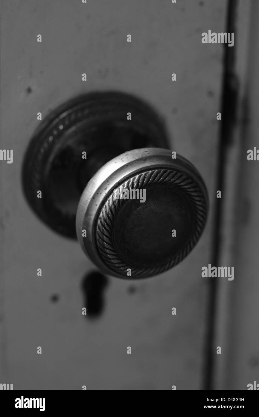 doorknob belonging to an old derelict cottage, very grainy image , iso 1000 Stock Photo