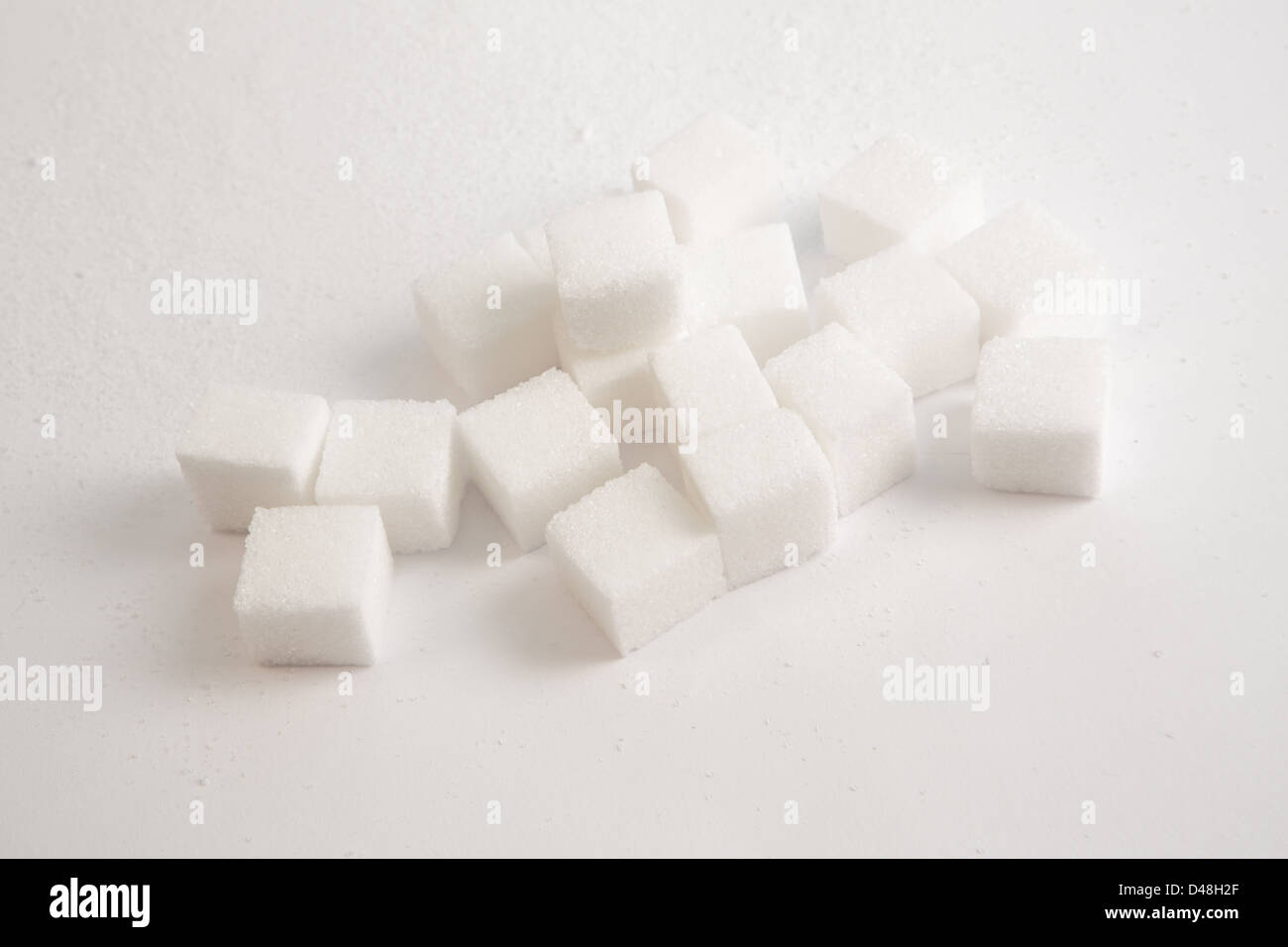 Pile of sugar lumps Stock Photo - Alamy