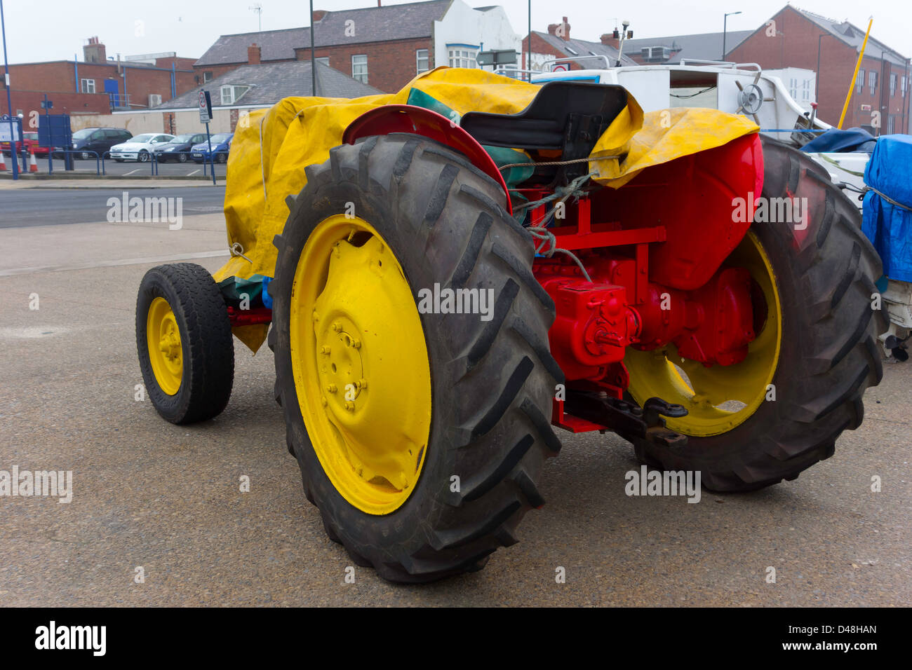 Red and yellow tractor vintage tractor hires stock photography and