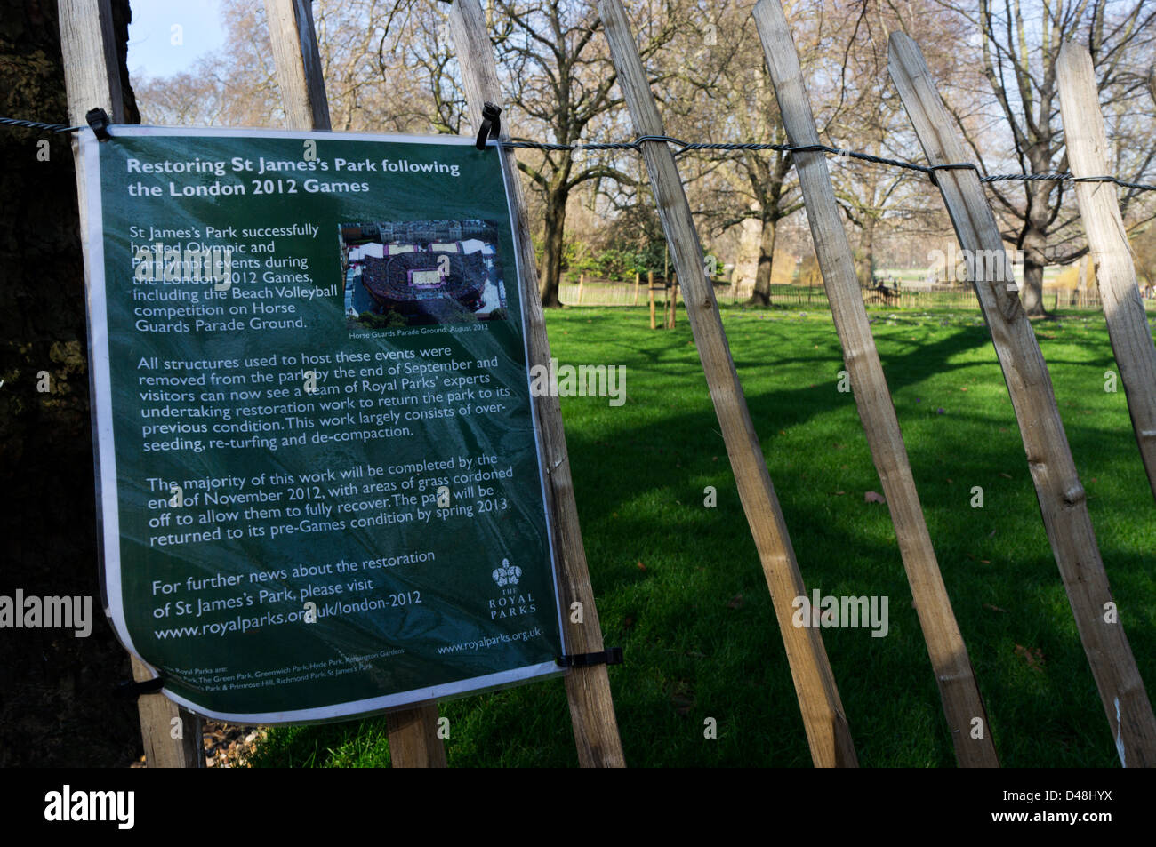 A notice gives a report on restoration of St James's Park following the 2012 Olympics. Stock Photo