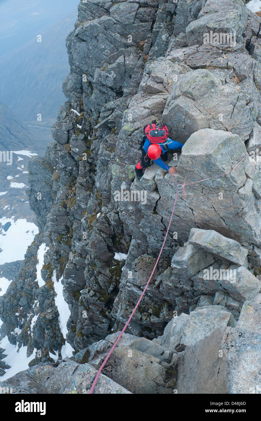 Climber descends into the Gap on the classic Tower Ridge climb on Ben