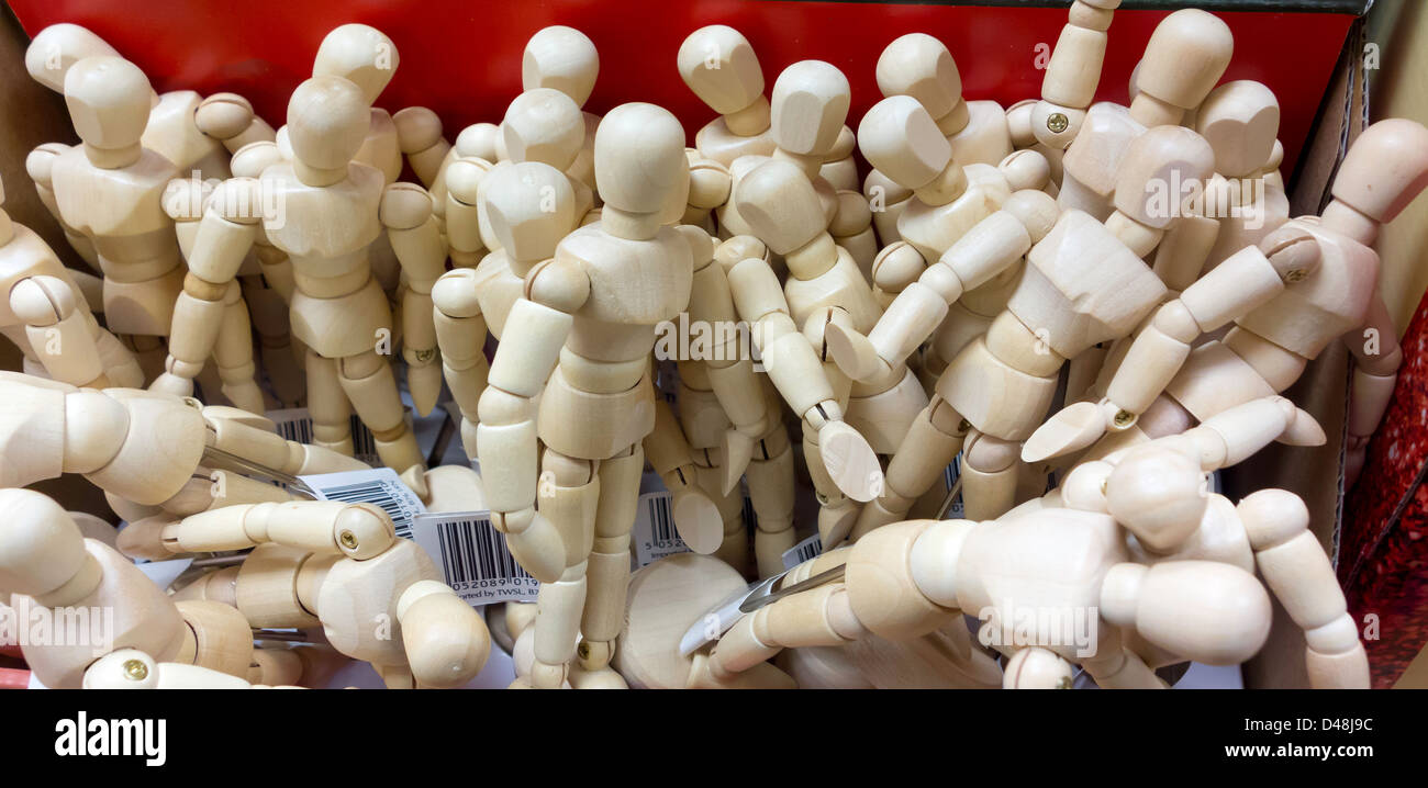 A box of miniature artist's mannequins for drawing figure studies Stock Photo
