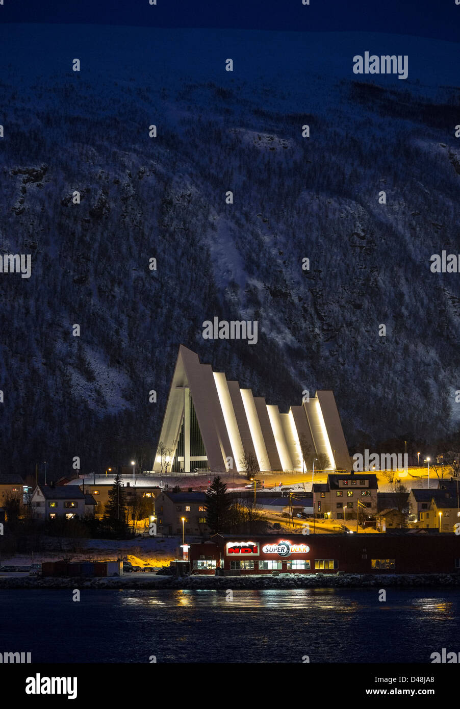 View across Tromso in Norway, towards the Tromsdalen Lutheran Church, by architect Jan Inge Hovig and built of concrete. Stock Photo