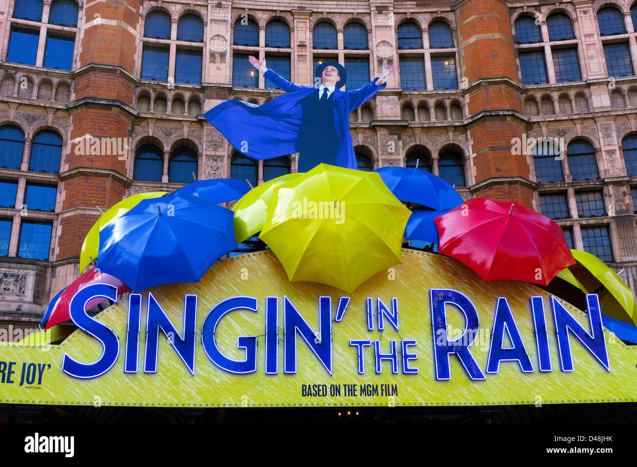 An advert for the musical 'Singin' in the Rain' covers the front of the Palace Theatre. Stock Photo
