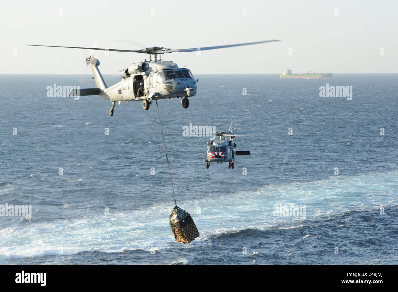 Sea Hawk helicopters conduct supply operations in the U.S. 5th Fleet ...