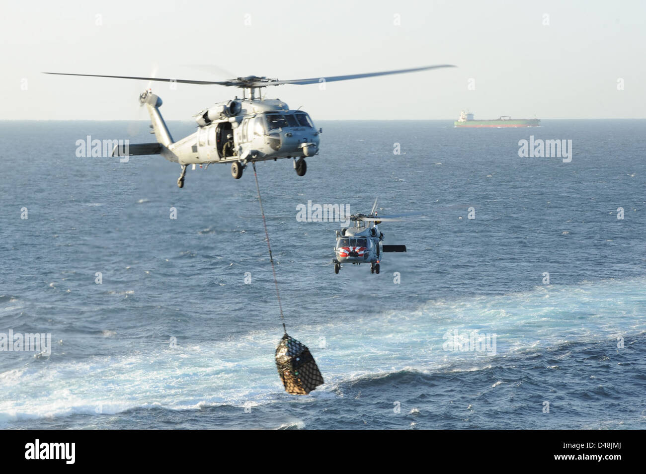 Sea Hawk helicopters move supplies. Stock Photo