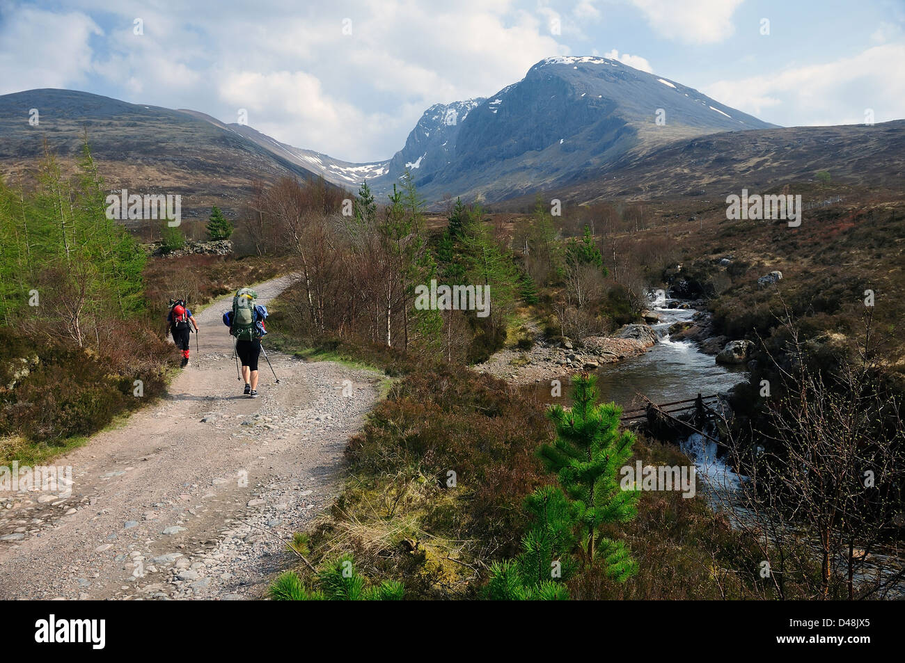 Two climbers on the approach path to the north-east face of Ben Nevis Stock Photo