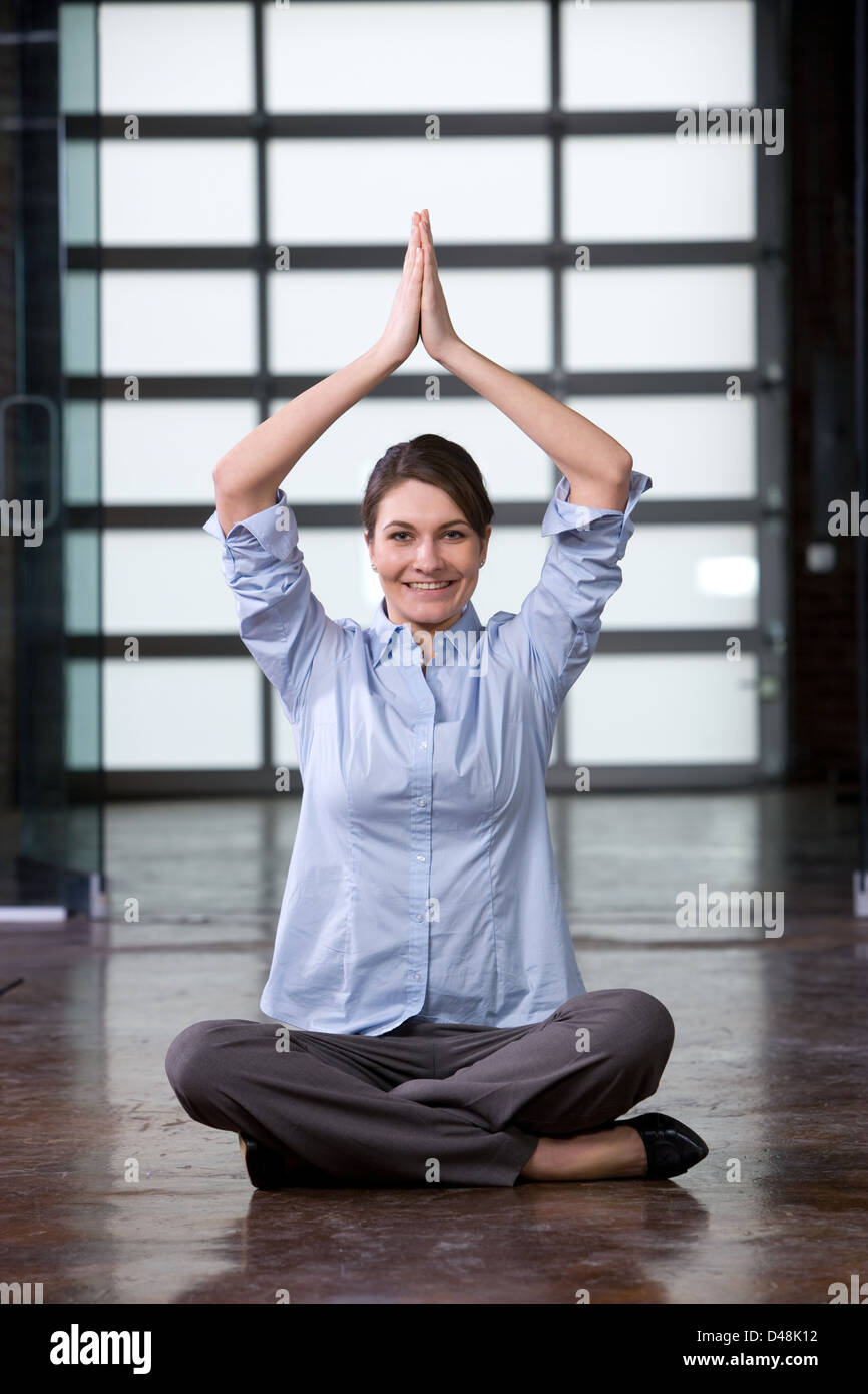 Business woman yoga at a modern office Stock Photo - Alamy