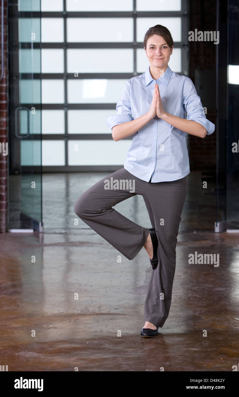 Business woman yoga at a modern office Stock Photo - Alamy