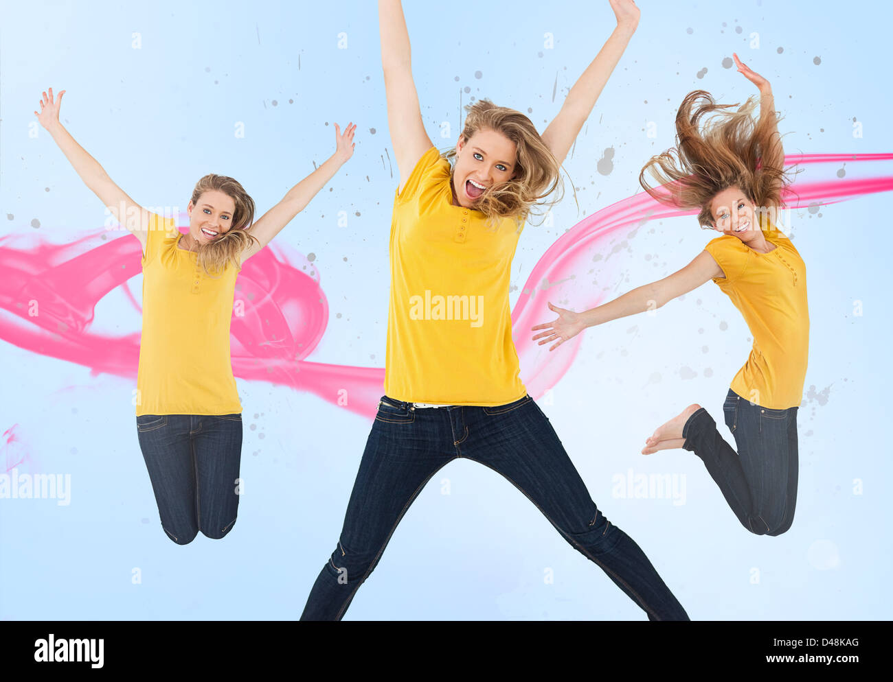 Three of the same young woman jumping for joy Stock Photo