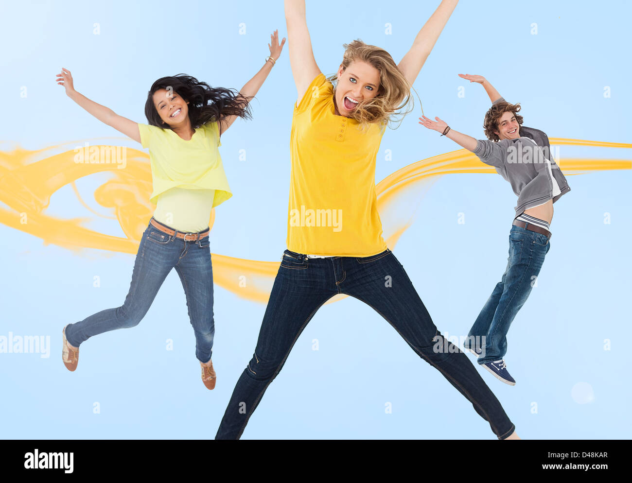 Three happy friends jumping for joy Stock Photo