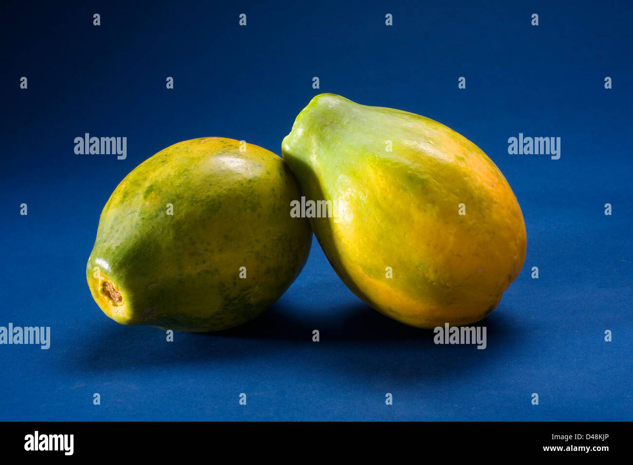 Studio Shot Of Two Papayas Stock Photo - Alamy