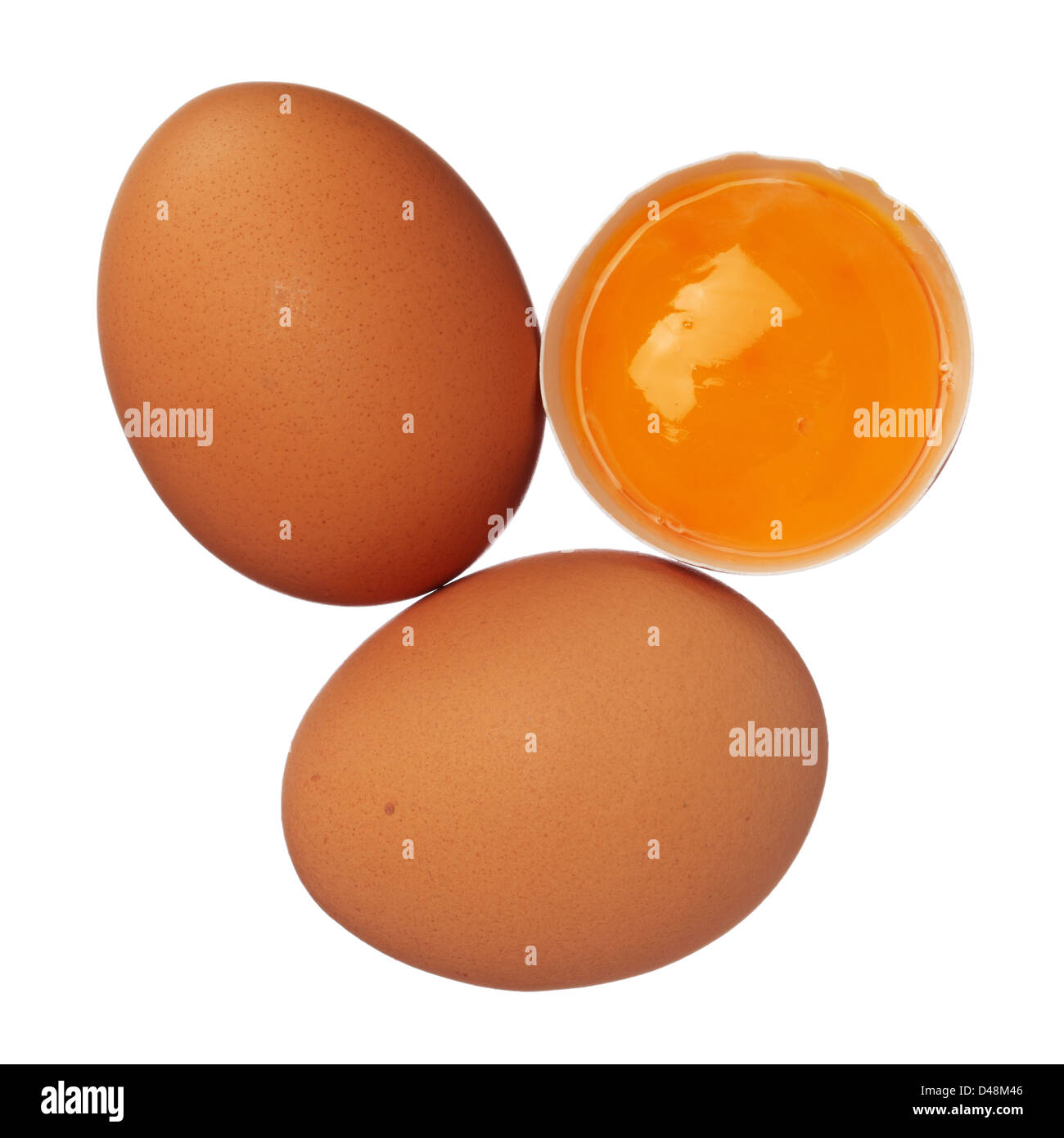 Whole eggs and egg yolk in shell isolated on white Stock Photo