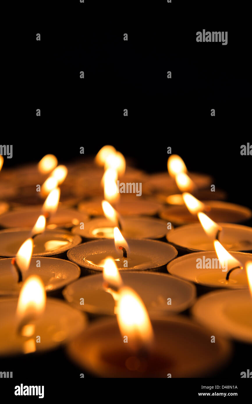 Candles lighting up the dark Stock Photo Alamy