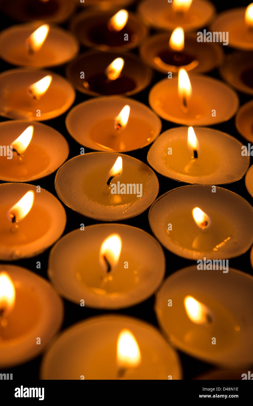 Candles lighting up the dark Stock Photo Alamy