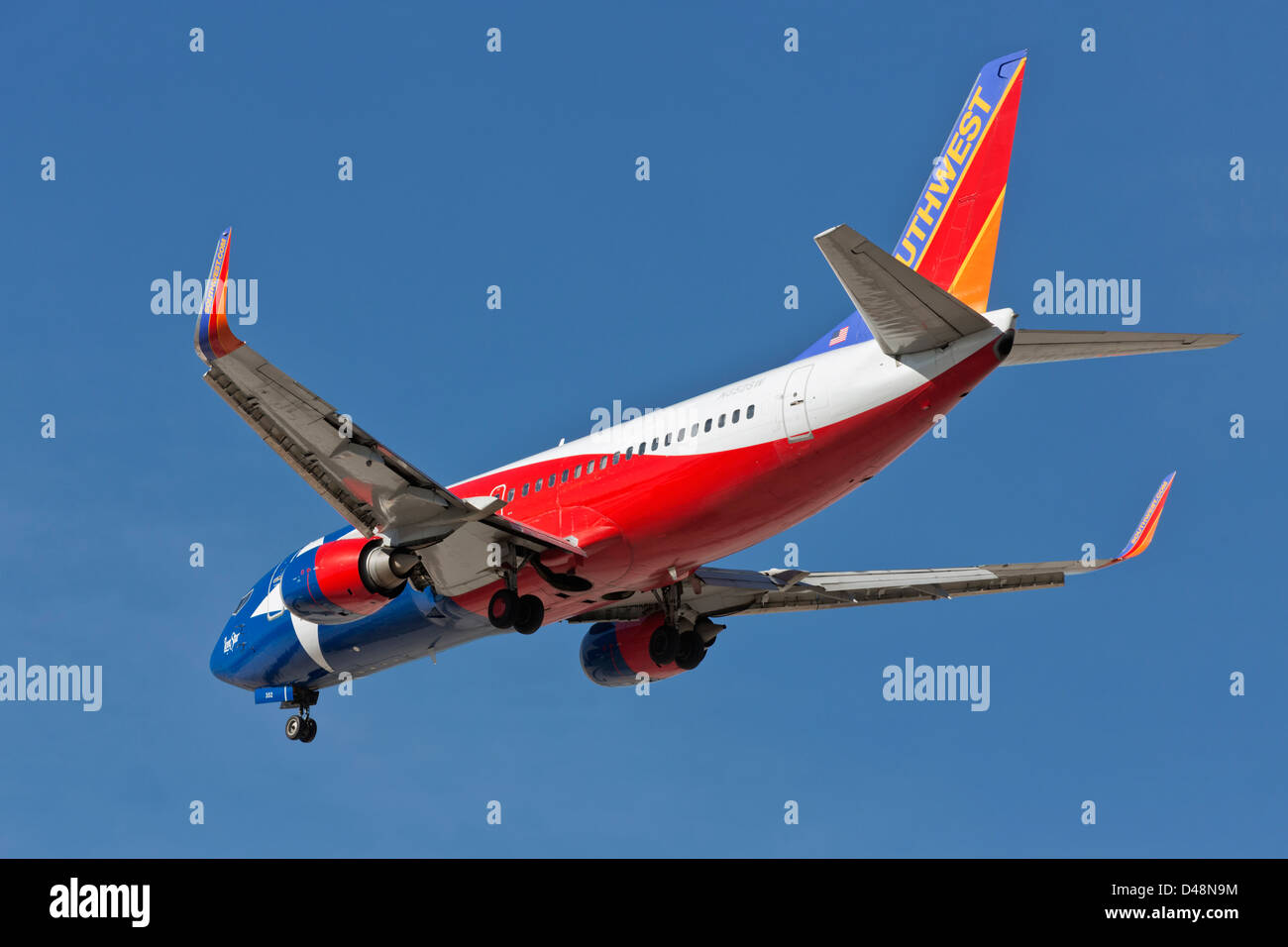 A Boeing 737 of Southwest airlines on final approach - Special Texas state paint scheme Stock Photo