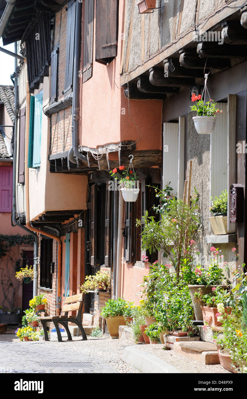 Pot plants and flowers adorn the from tot the old medieval houses in the centre of town. Albi, Tarn, France Stock Photo