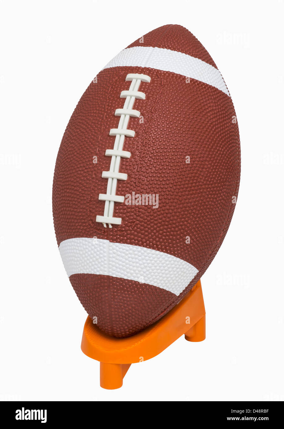 Football on tee, isolated on white, includes clipping path Stock Photo
