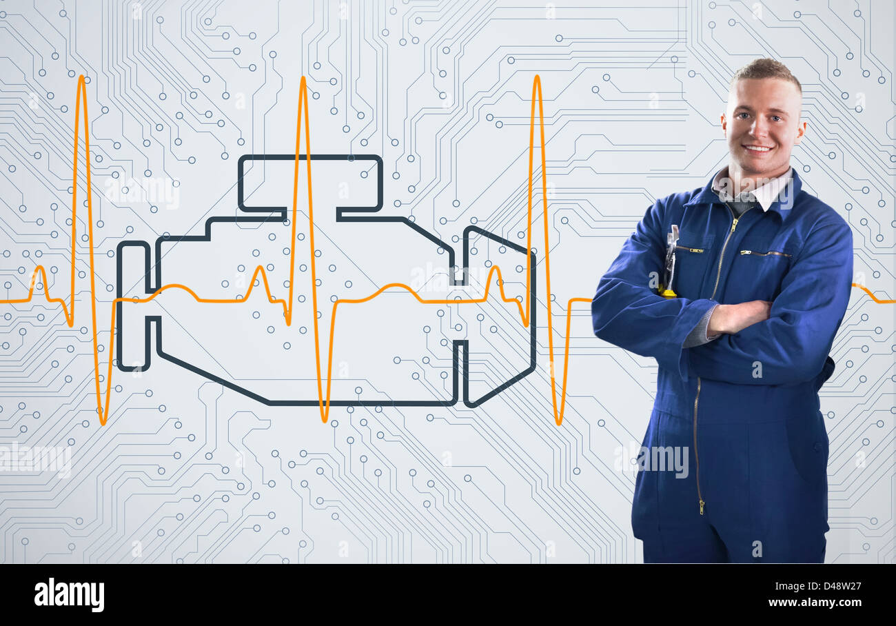 Mechanic standing proudly in front of engine background Stock Photo