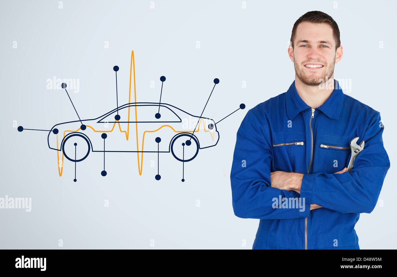 Portrait of a young mechanic next to background with car Stock Photo
