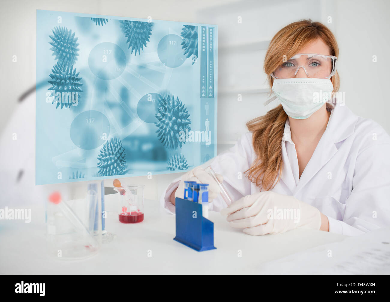 Scientist working in the lab with futuristic interface Stock Photo