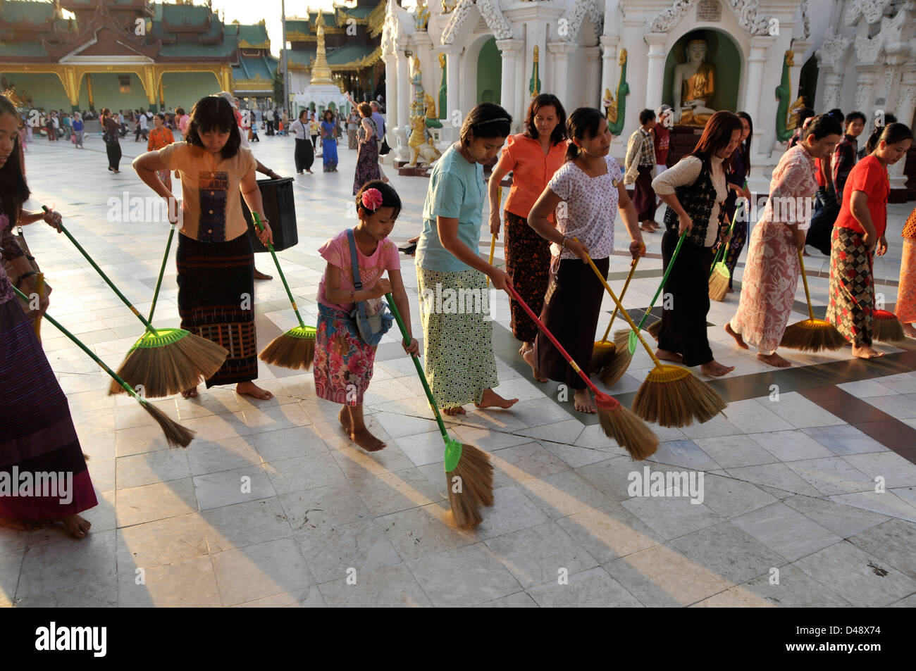 Ritual Floor Sweeping, Shwedagon Pagoda, Yangon, Myanmar, Asia Stock Photo