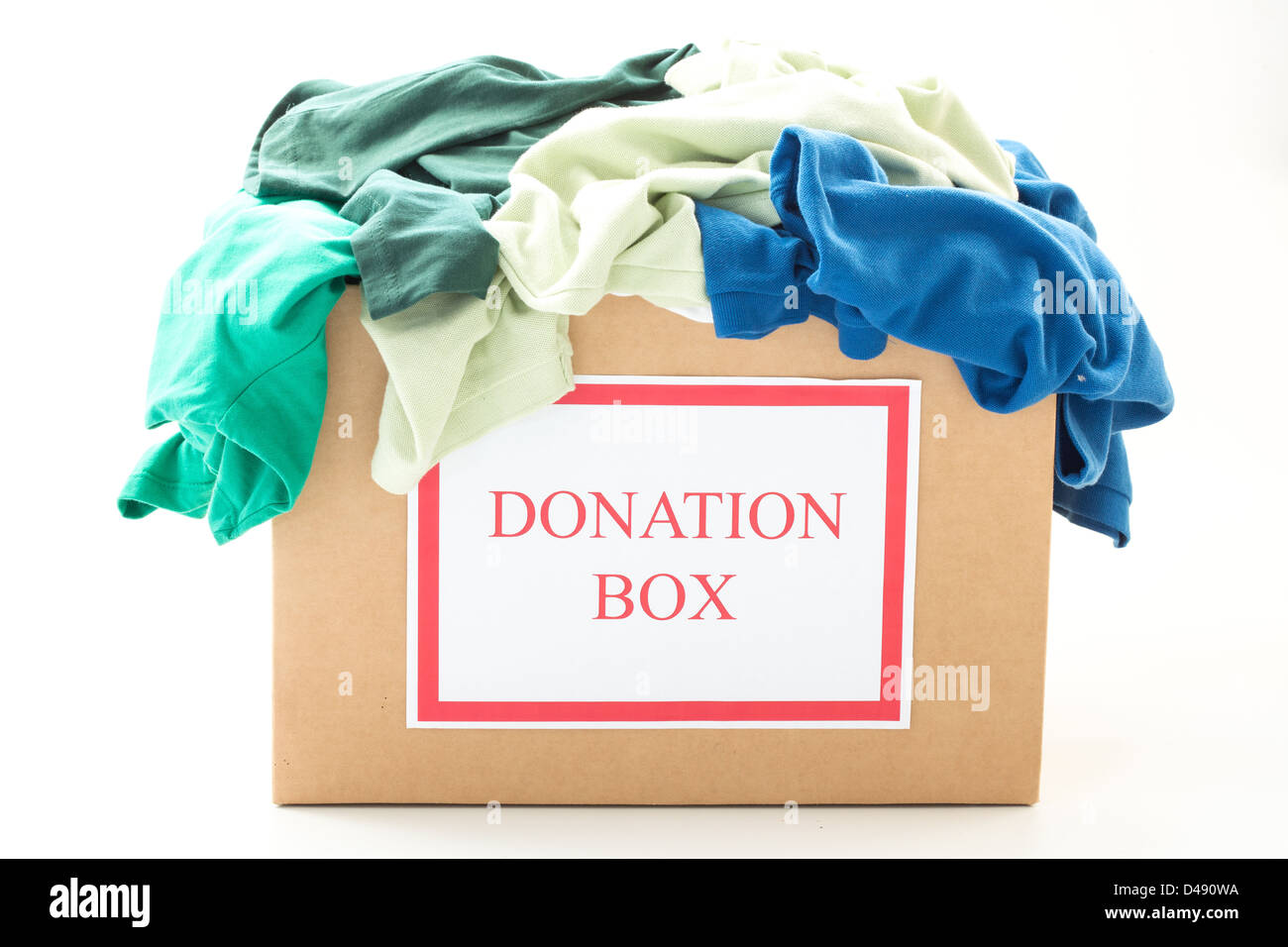 Cardboard donation box with clothes Stock Photo