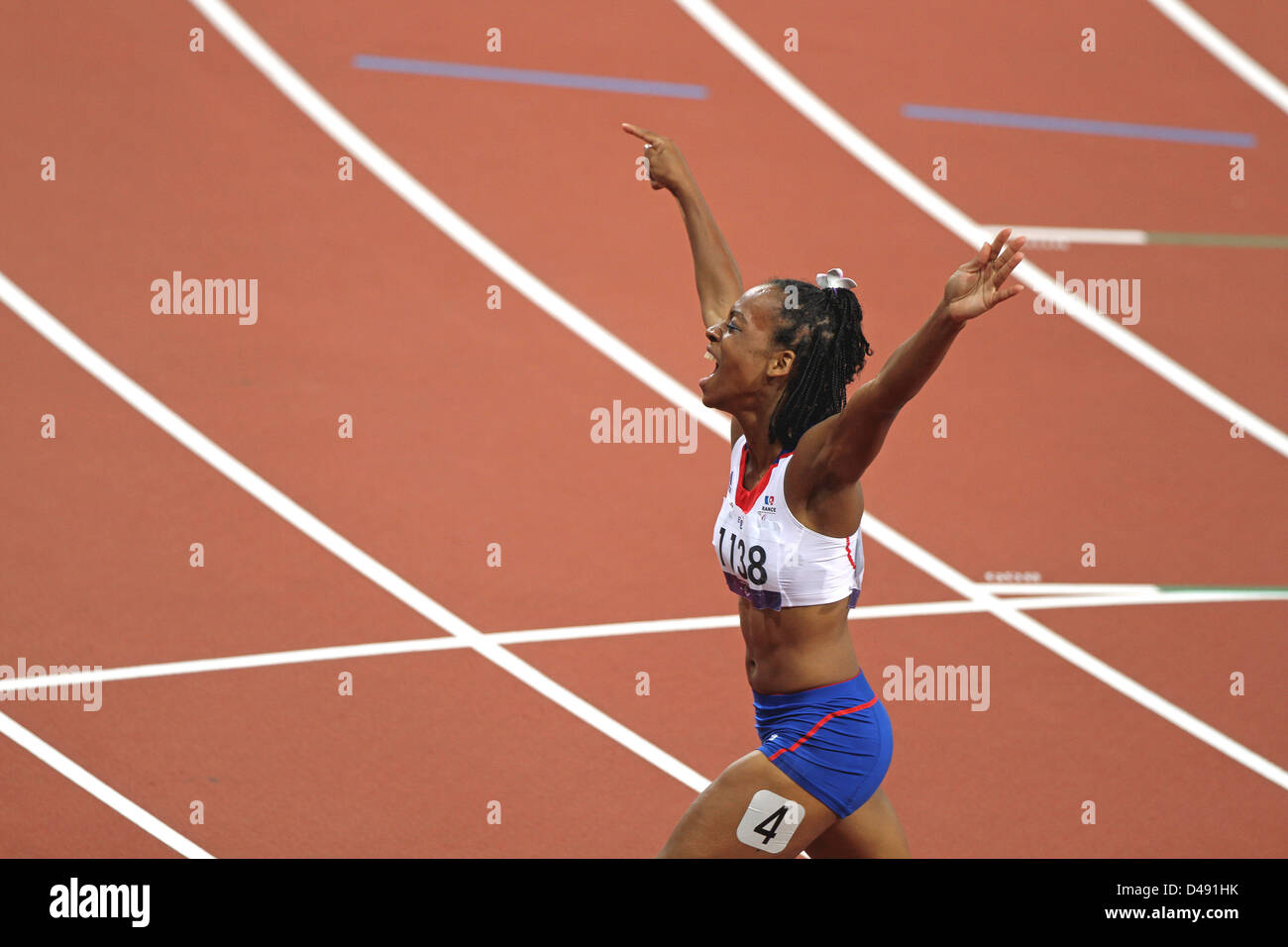 Mandy Francois-Elie of France celebrates winning gold in womens 100m T37 in Olympic stadium at the London 2012 Paralympic games. Stock Photo