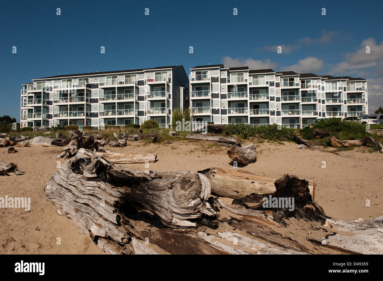 Siletz Bay, USA, with the bay Baumstaemmen and new apartments in the background Stock Photo