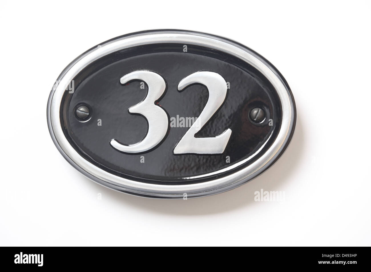 Number 32 black and chrome house plate. Stock Photo
