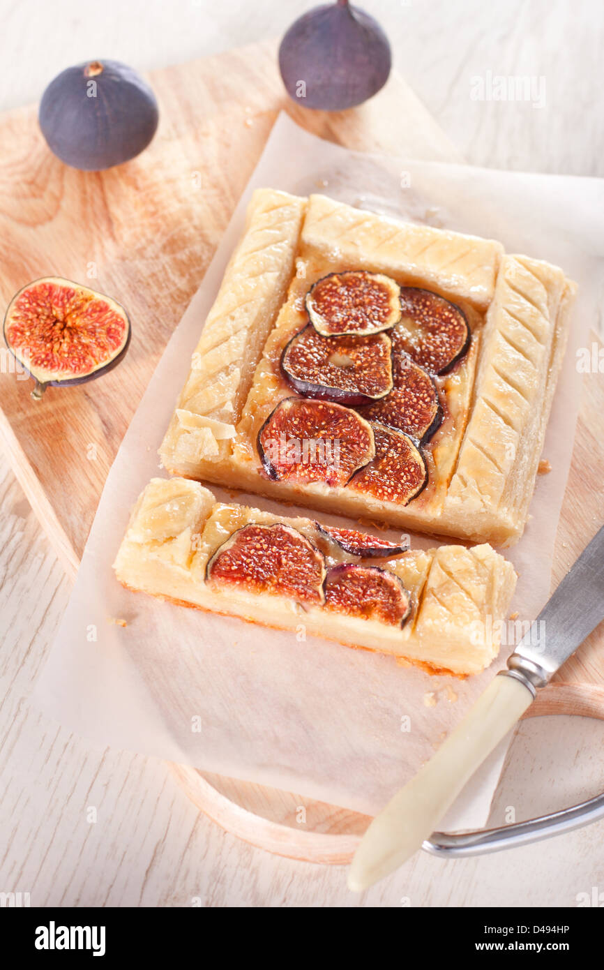 Gourmet puff pastry tart with figs, cheese and honey Stock Photo