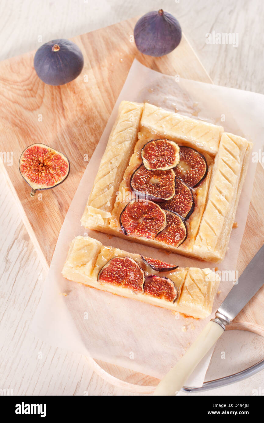 Gourmet puff pastry tart with figs, cheese and honey Stock Photo