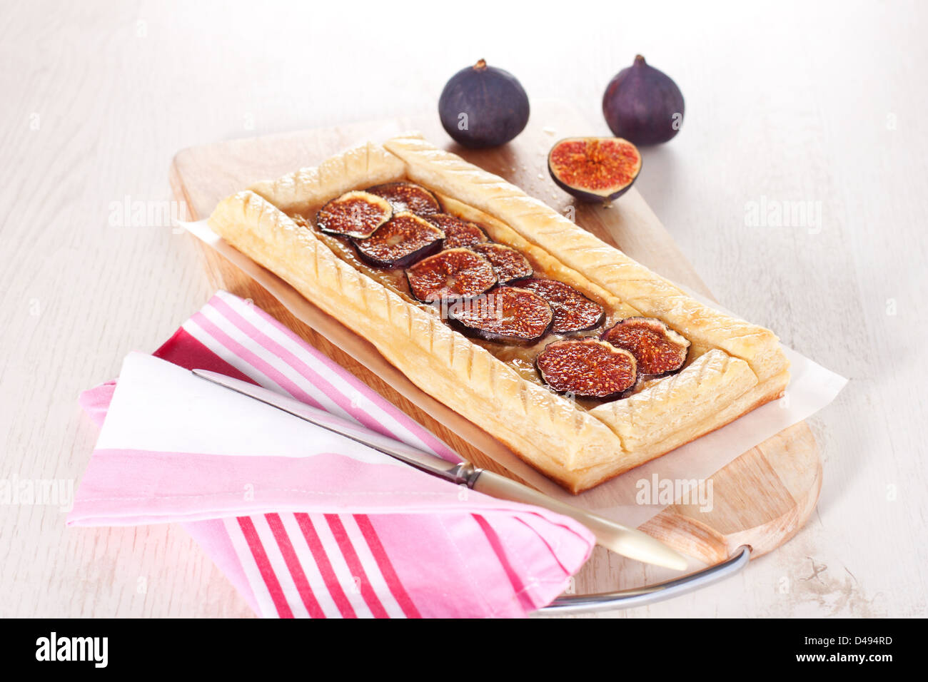 Gourmet puff pastry tart with figs, cheese and honey Stock Photo