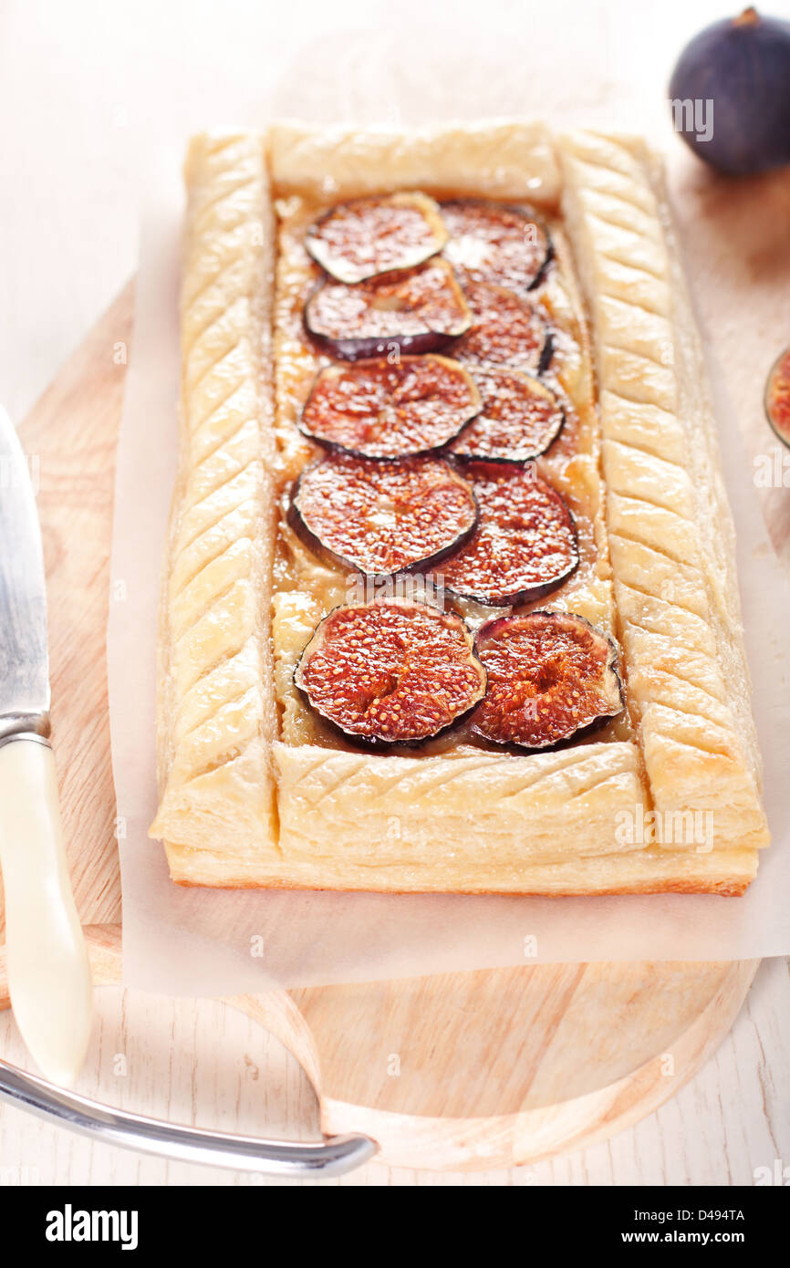 Gourmet puff pastry tart with figs, cheese and honey Stock Photo