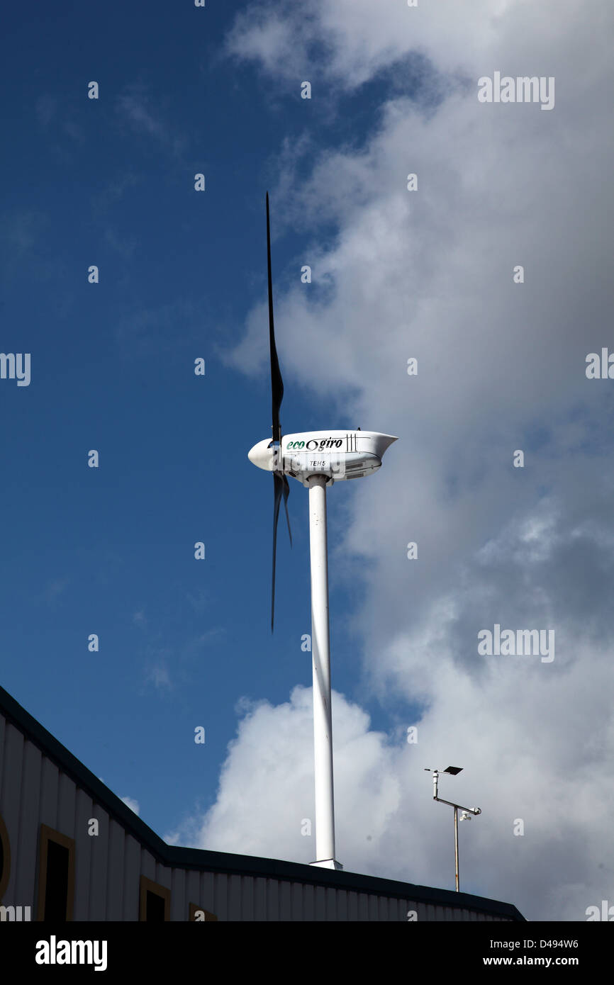 electric producing wind turbine on roof Stock Photo Alamy