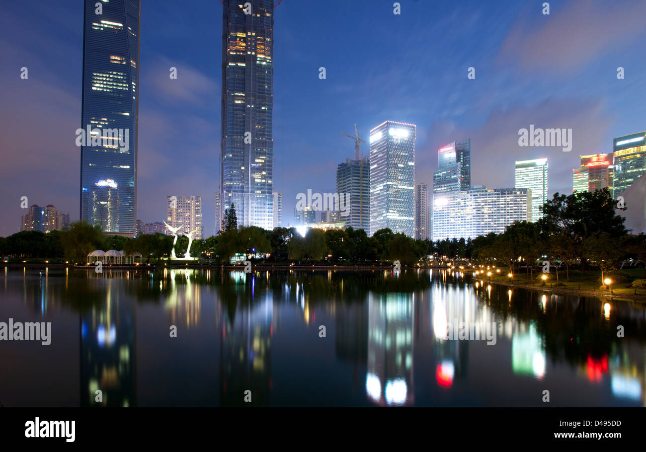 Shanghai Lujiazui Finance & City Buildings night landscape reflected in the pond Stock Photo