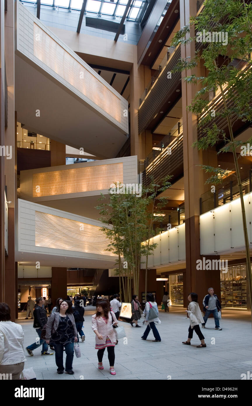 Multi-story shopping mall atrium at modern Tokyo Midtown, a mixed-use shopping, hotel and residential complex in Roppongi, Tokyo Stock Photo