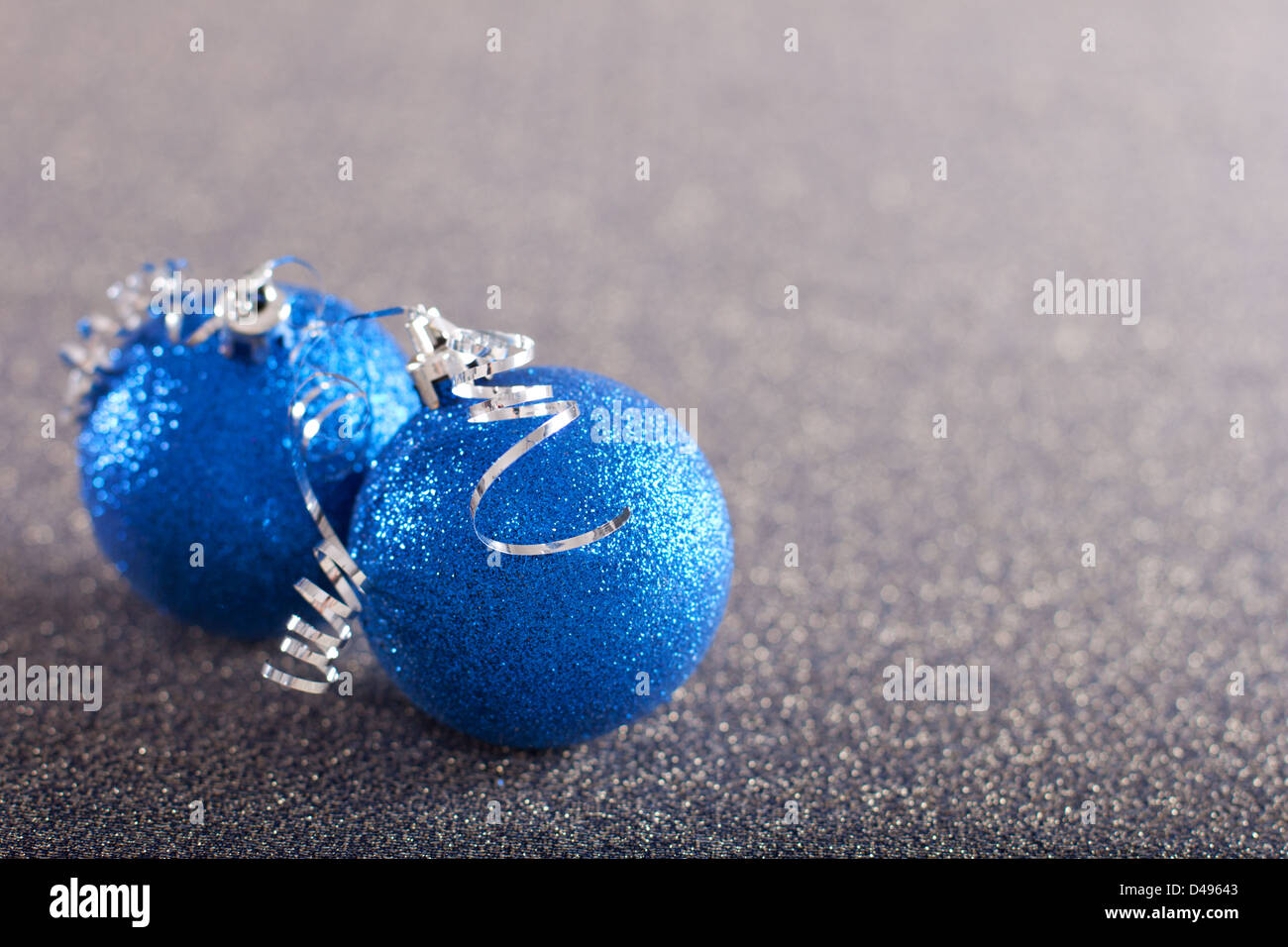 Blue christmas balls on silver background Stock Photo - Alamy