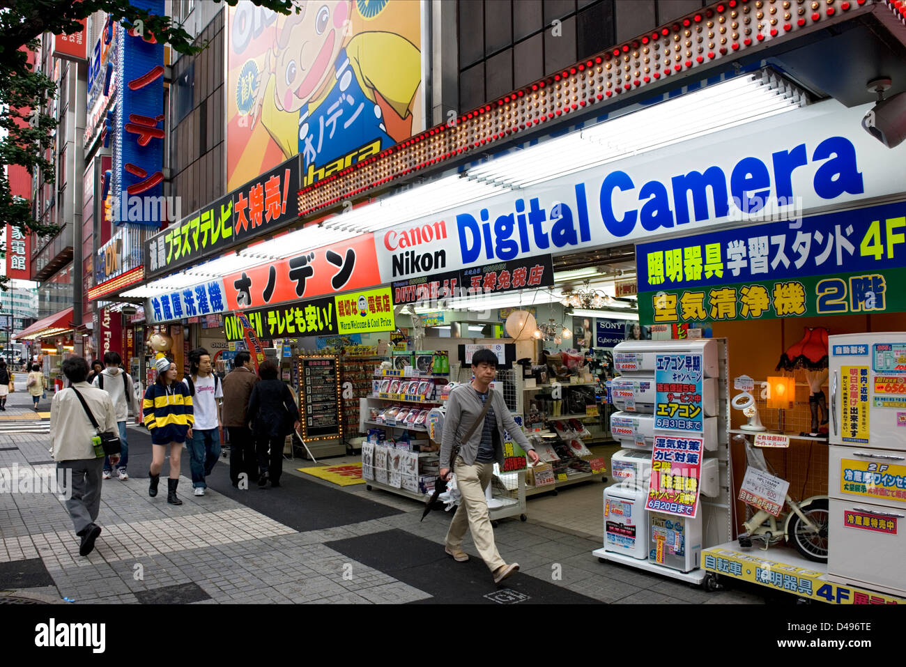 Side-by-side retail shops selling computers, software, cameras and anime products in consumer electronics Akihabara district Stock Photo