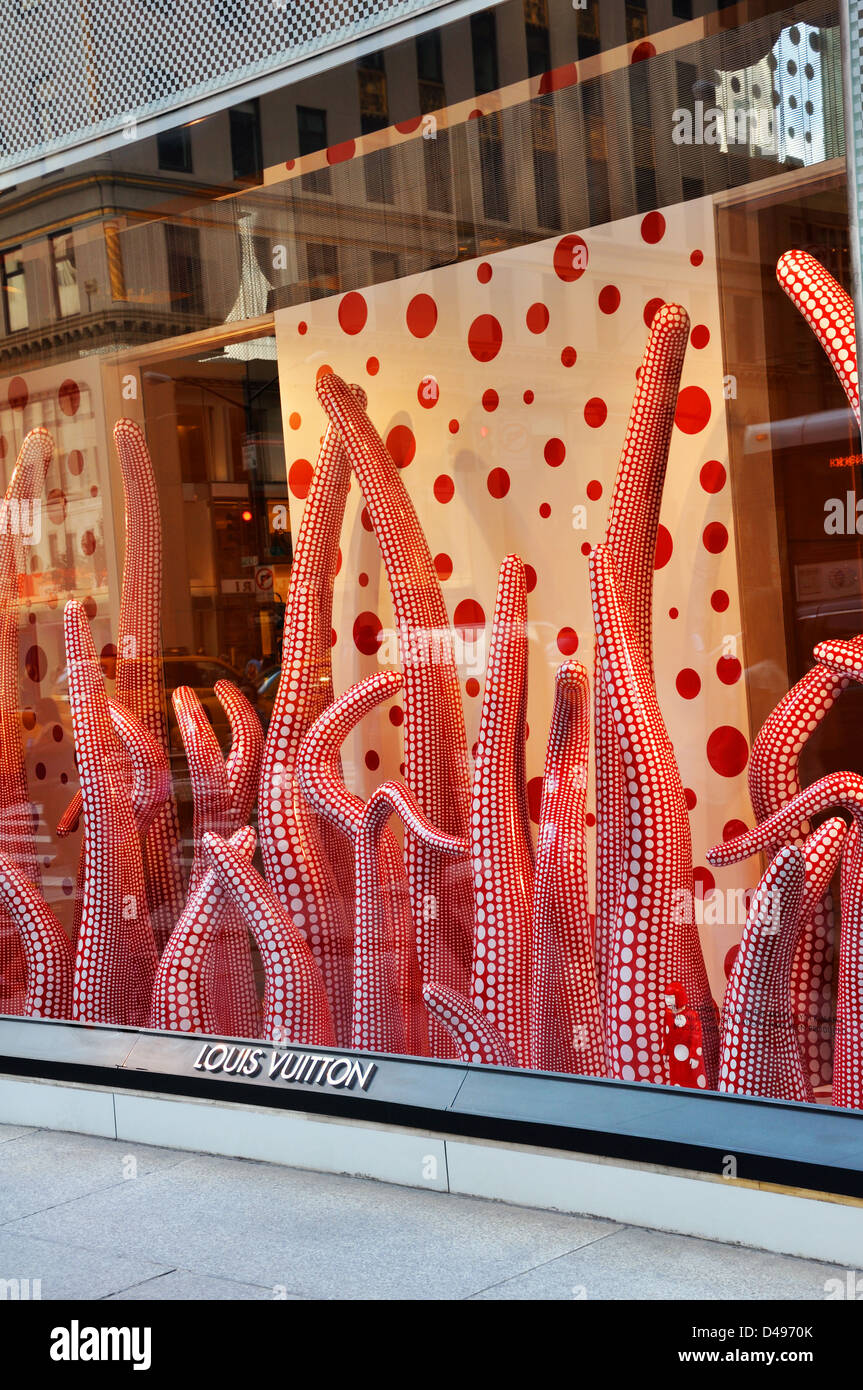 LV,  in a shop window at the Louis Vuitton store in the …