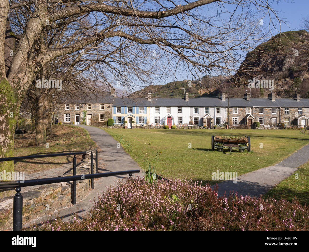 Traditional Welsh cottages overlooking green in picturesque Beddgelert village in Snowdonia National Park Gwynedd North Wales UK Stock Photo