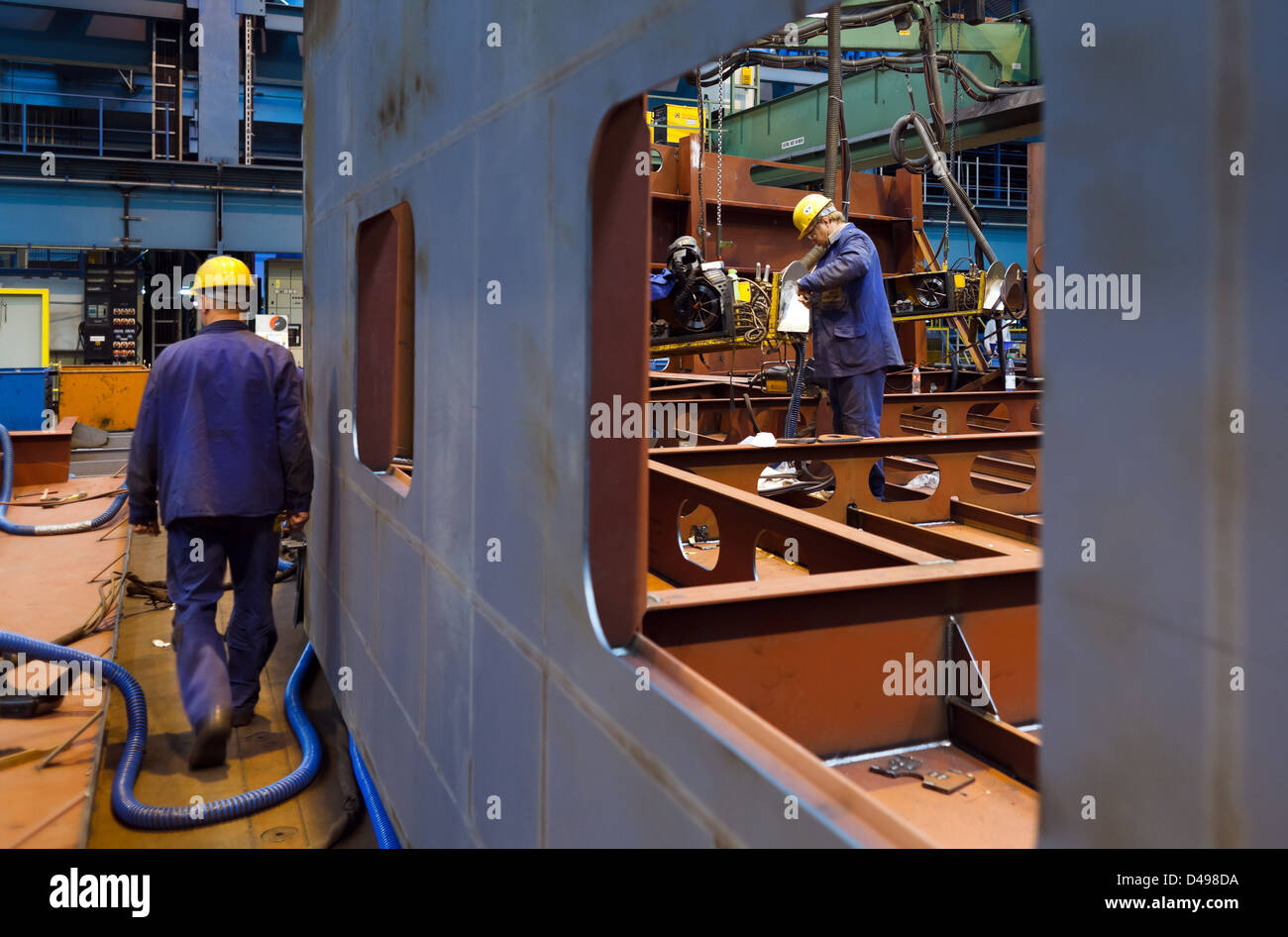 Papenburg, Germany, Meyer Werft GmbH, an employee of the Meyer Werft shipyard in the halls Stock Photo