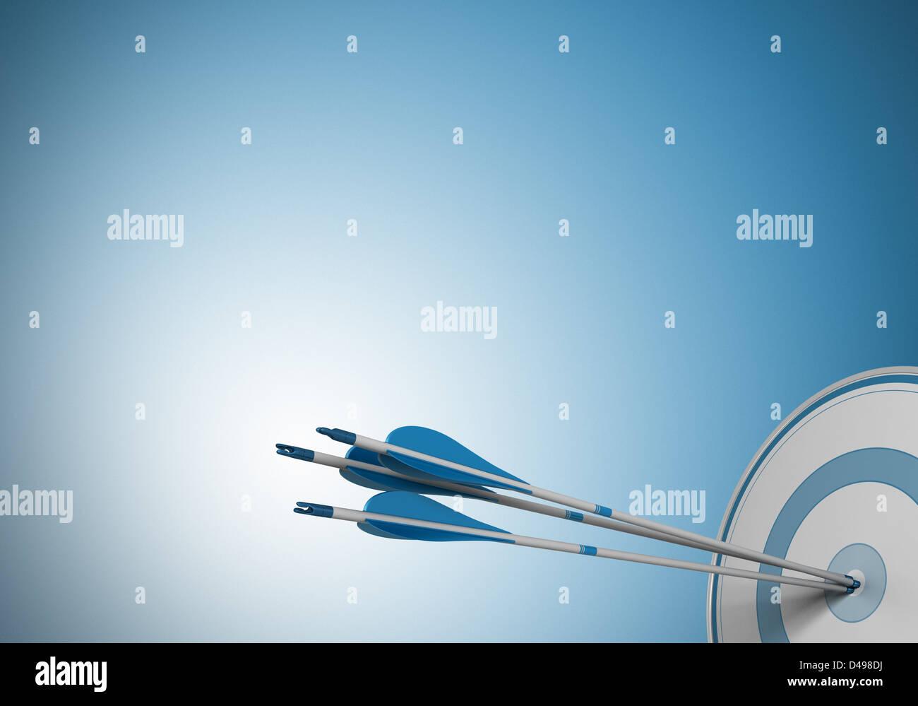 three arrows hitting the center of a target. Image over a blue background with free space for text Stock Photo