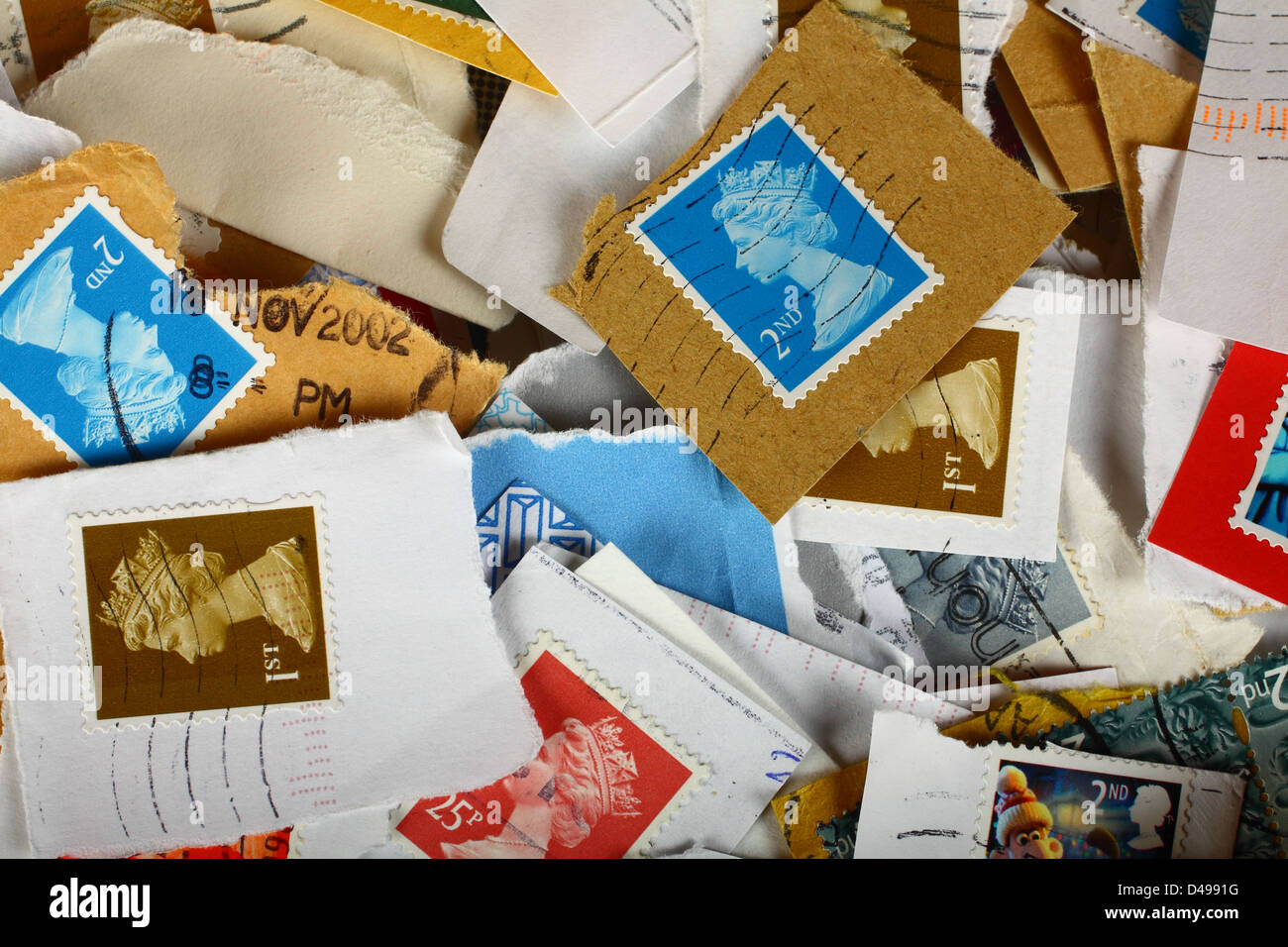 Mixture of used postage stamps Stock Photo