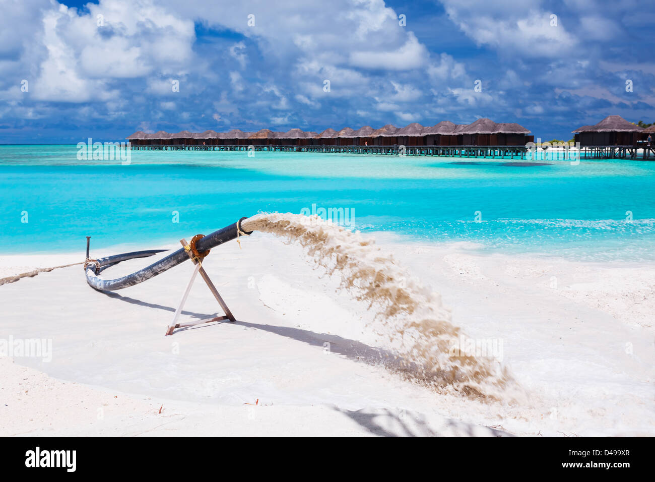 Beach nourishment to replace sand eroded by waves and storms Stock Photo