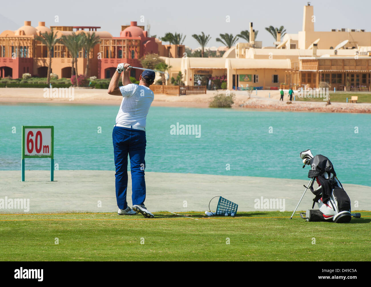 Male golfer training on a driving range Stock Photo