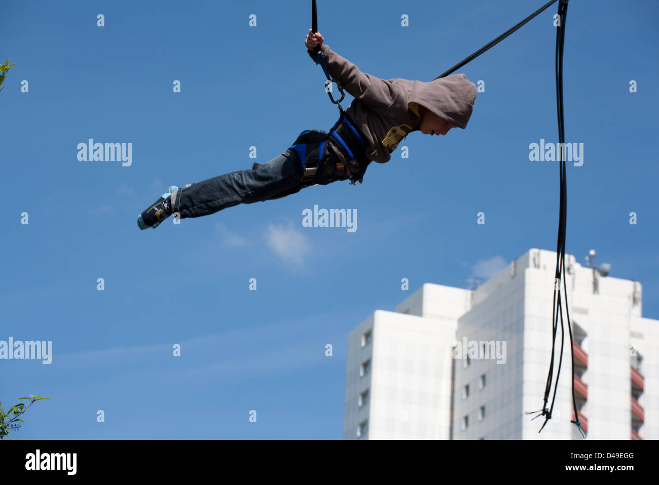 Berlin, Germany, boy floats in the air jumping on the trampoline Stock Photo